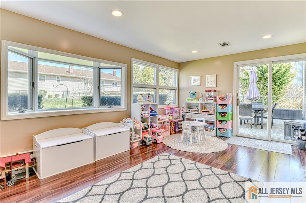 35 Outcalt Road Edison, NJ 08817 - Photo 20 of 33 a living room with fireplace furniture and a large window