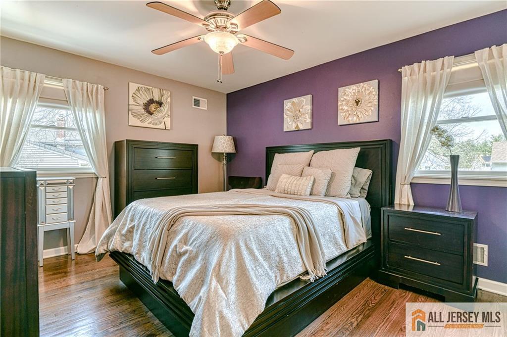35 Outcalt Road Edison, NJ 08817 - Photo 21 of 33 a bedroom with a bed and a chandelier