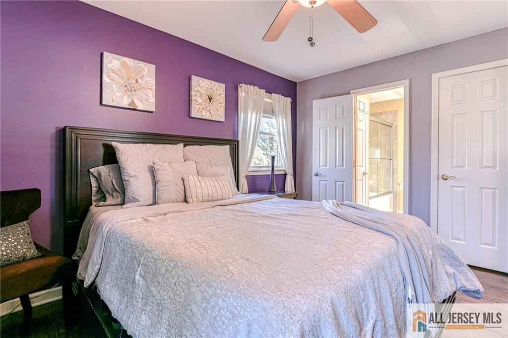 35 Outcalt Road Edison, NJ 08817 - Photo 22 of 33 a large bed sitting in a bedroom next to a window