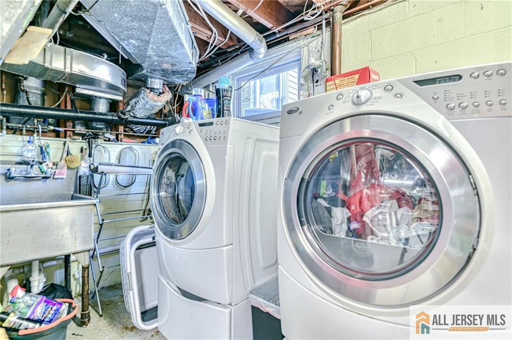 35 Outcalt Road Edison, NJ 08817 - Photo 26 of 33 a utility room with dryer and washer