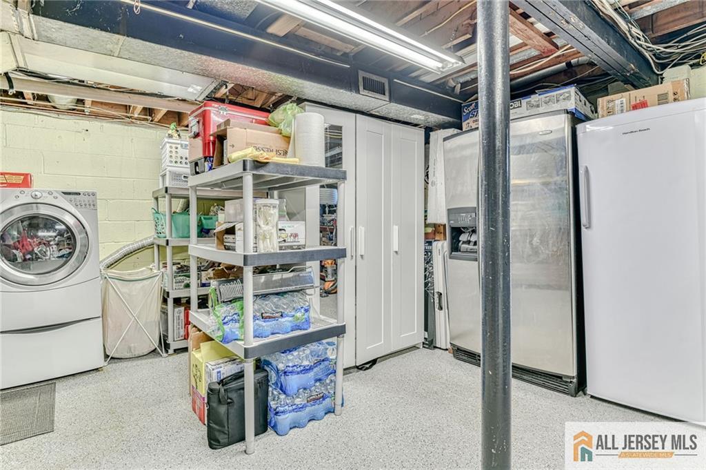 35 Outcalt Road Edison, NJ 08817 - Photo 27 of 33 a utility room with dryer and washer