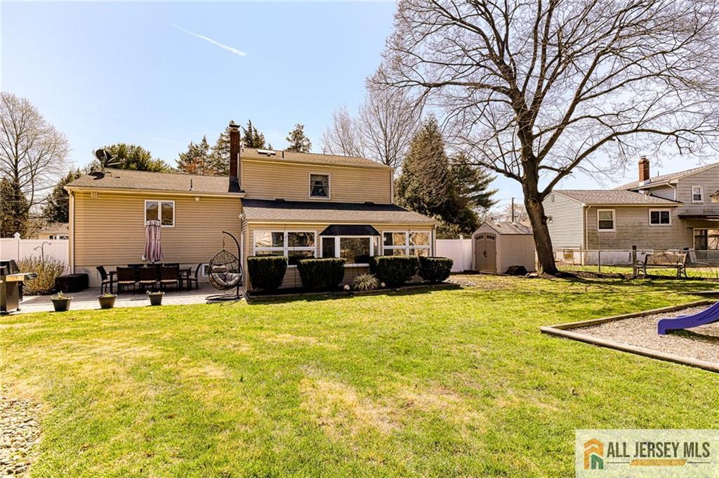 35 Outcalt Road Edison, NJ 08817 - Photo 30 of 33 a front view of house with yard and trees in the background