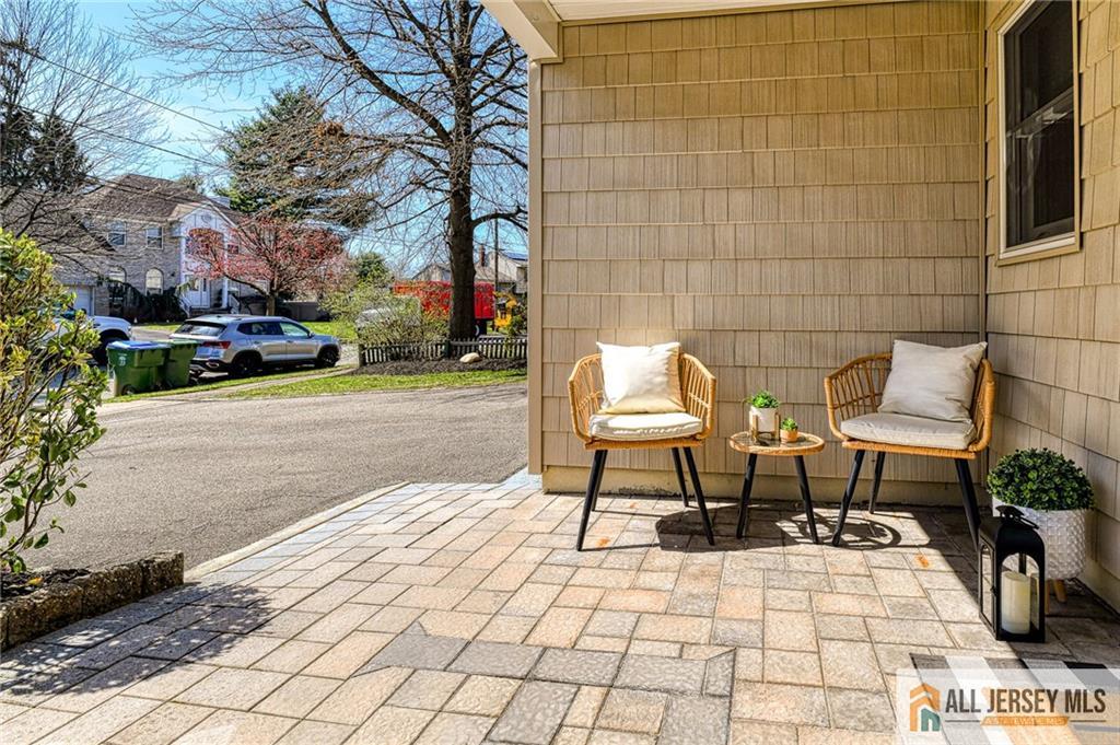 35 Outcalt Road Edison, NJ 08817 - Photo 3 of 33 a view of a patio with table and chairs with wooden floor and fence