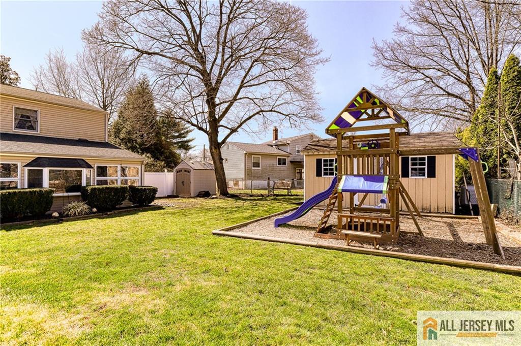 35 Outcalt Road Edison, NJ 08817 - Photo 32 of 33 a view of swimming pool with lawn chairs and plants