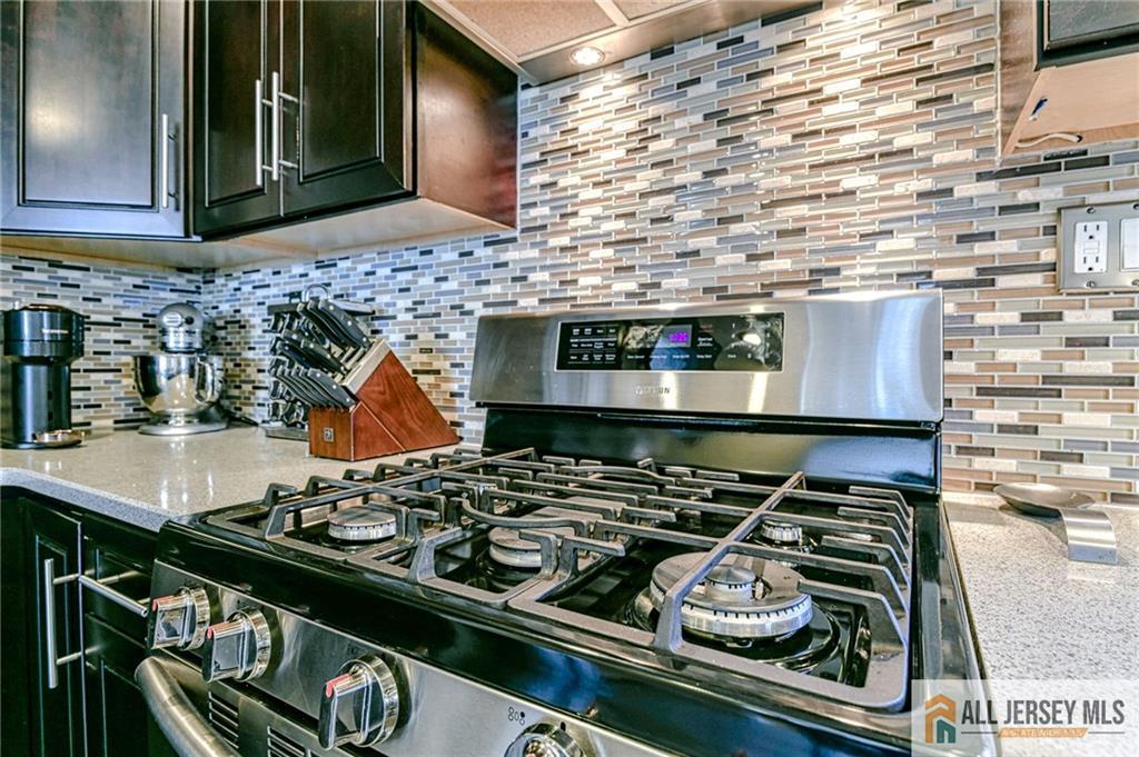 35 Outcalt Road Edison, NJ 08817 - Photo 8 of 33 a stove top oven sitting inside of a kitchen