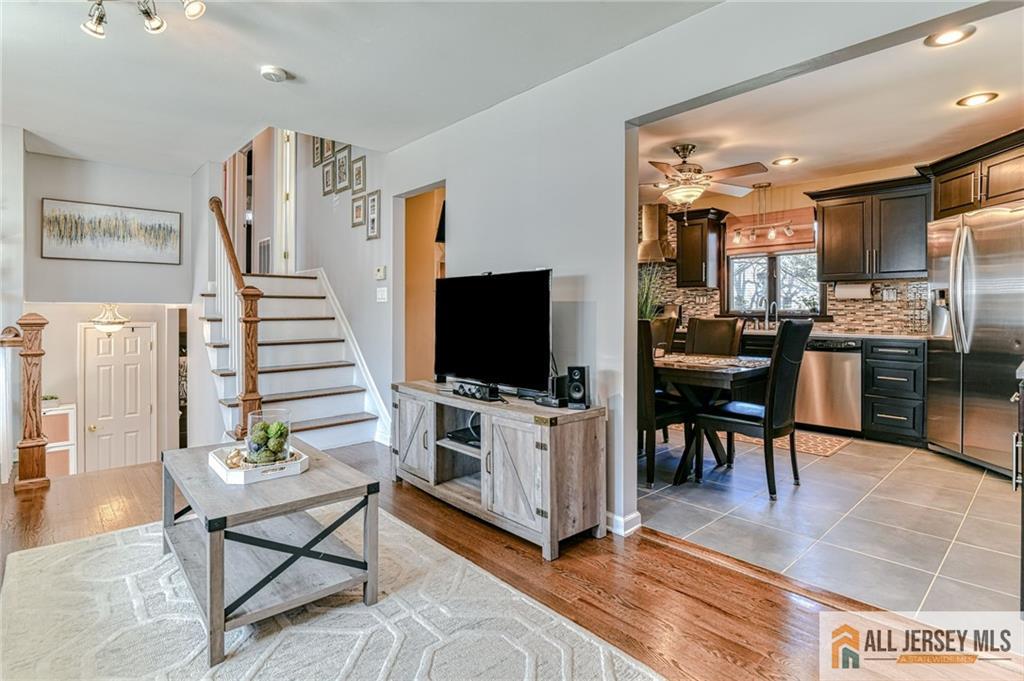 35 Outcalt Road Edison, NJ 08817 - Photo 10 of 33 a living room with furniture and a flat screen tv