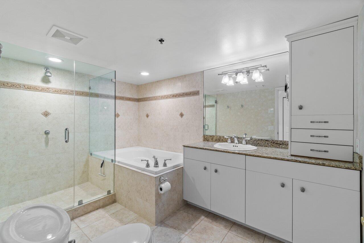1401 South Ocean Boulevard, Unit 3090 Boca Raton, FL 33432 - Photo 15 of 46 a spacious bathroom with a granite countertop sink mirror and shower
