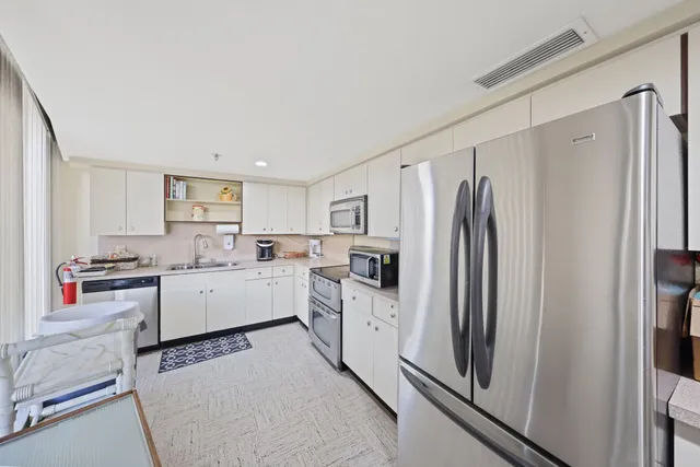 a swimming pool with outdoor seating and city view