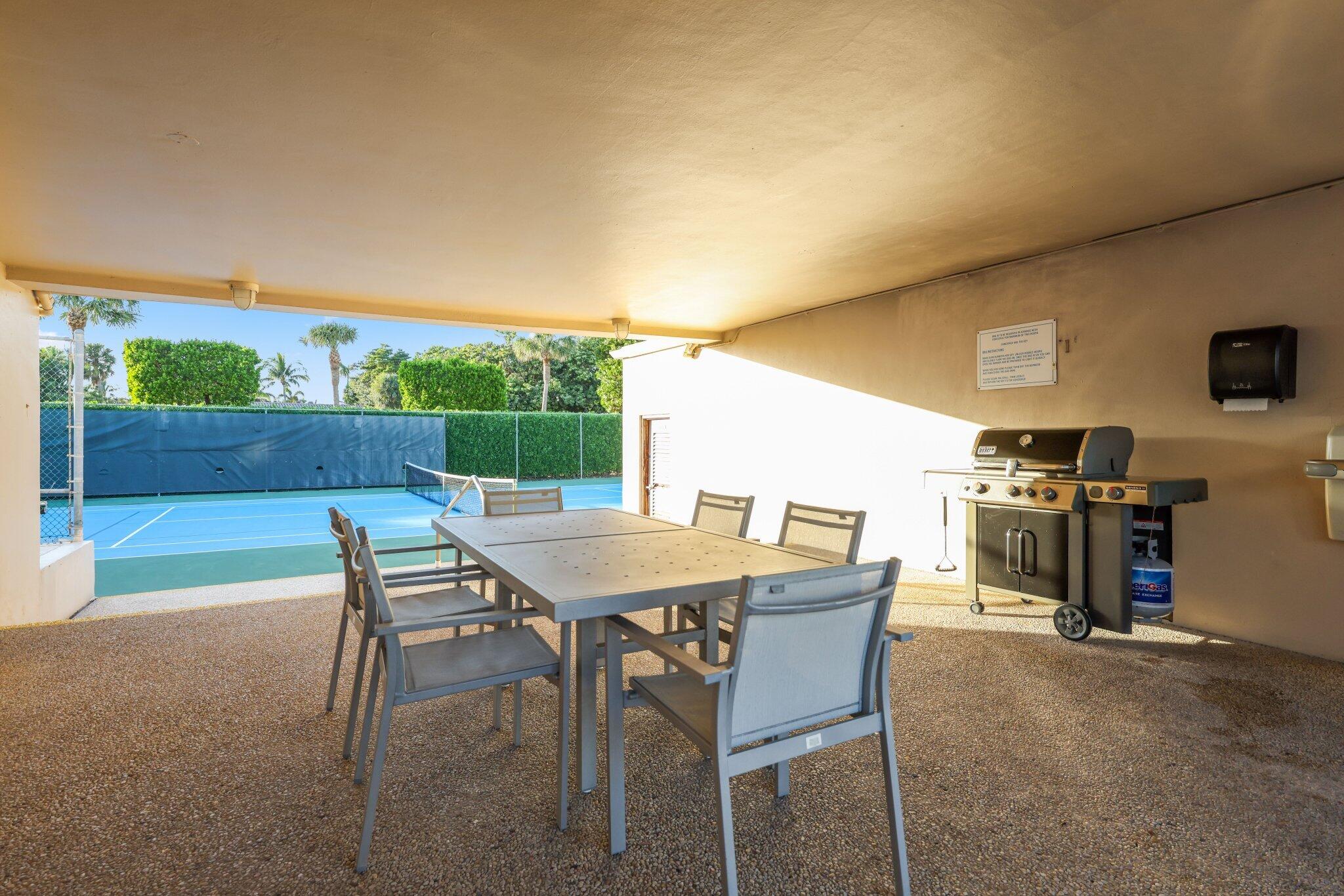 1401 South Ocean Boulevard, Unit 3090 Boca Raton, FL 33432 - Photo 35 of 46 a view of a patio with a table and chairs