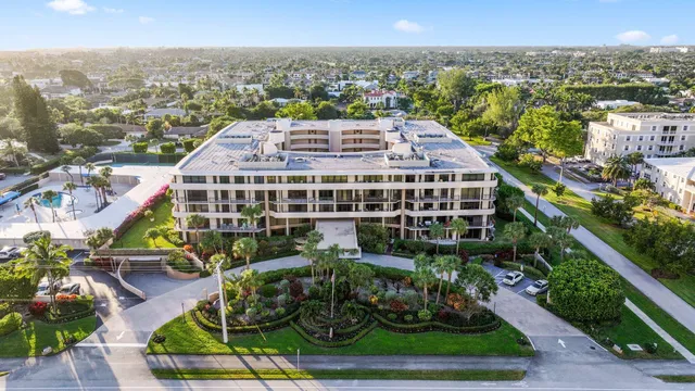 a view of a book shelf with lounge chair