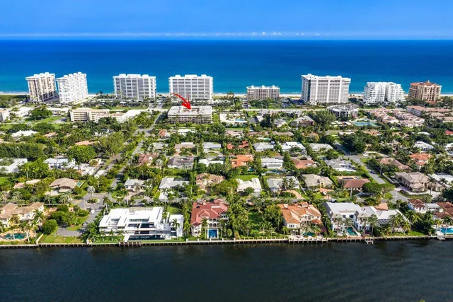 an aerial view of a house with a ocean view