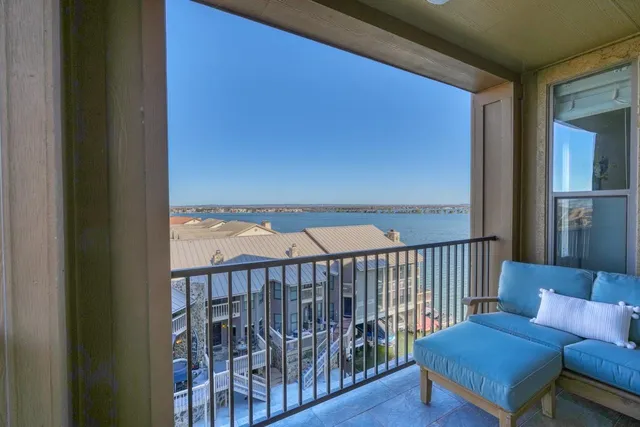 a view of a balcony with furniture