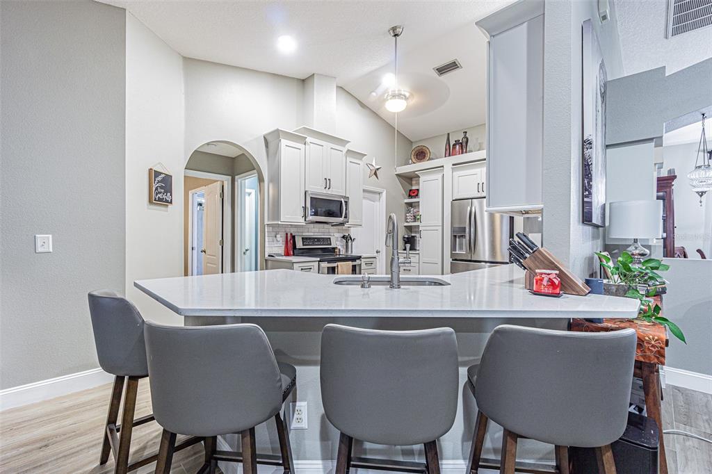9809 La Rita Place Riverview, FL 33569 - Photo 26 of 59 a view of a dining room with furniture and a chandelier