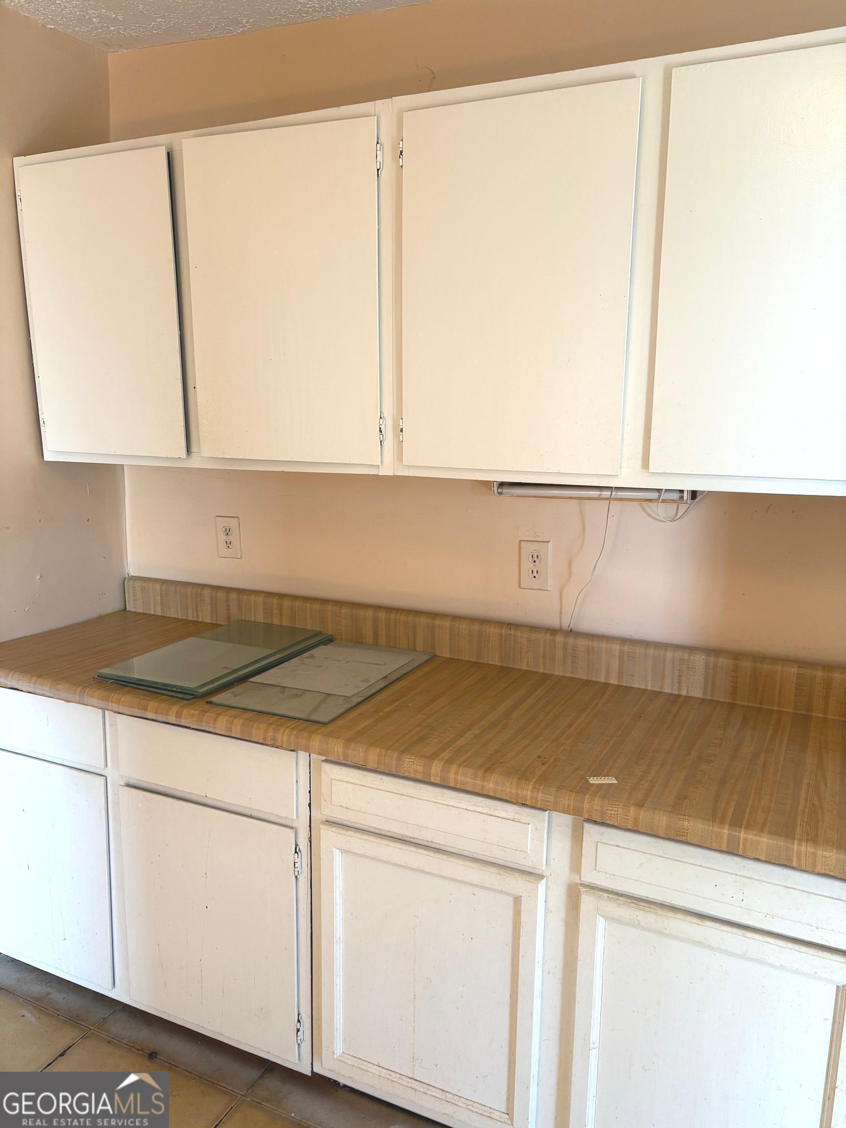 290 Florida Avenue Southwest Atlanta, GA 30310 - Photo 12 of 12 a kitchen with a white cabinets and a stove