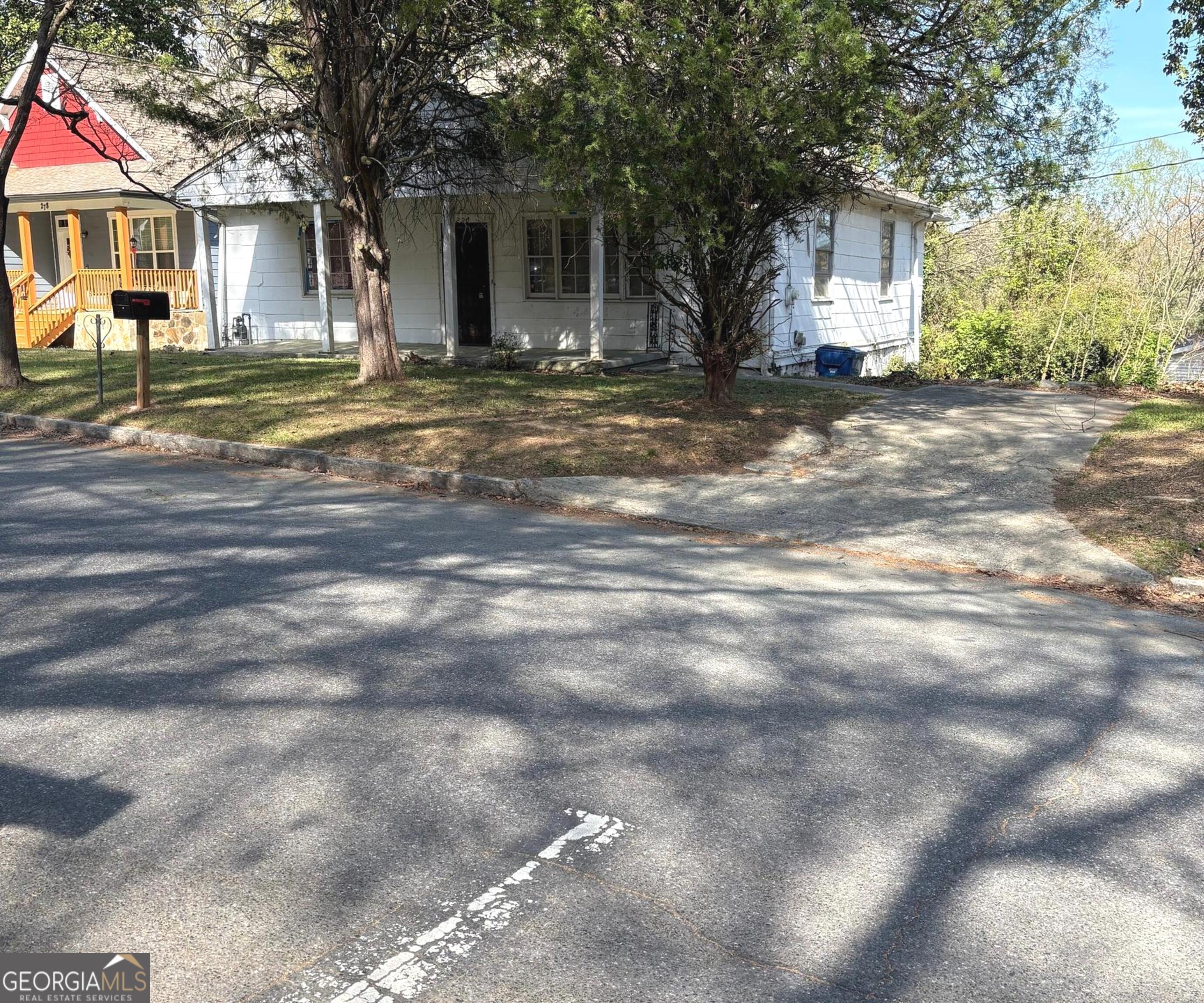 290 Florida Avenue Southwest Atlanta, GA 30310 - Photo 2 of 12 a view of a house with a yard and large trees