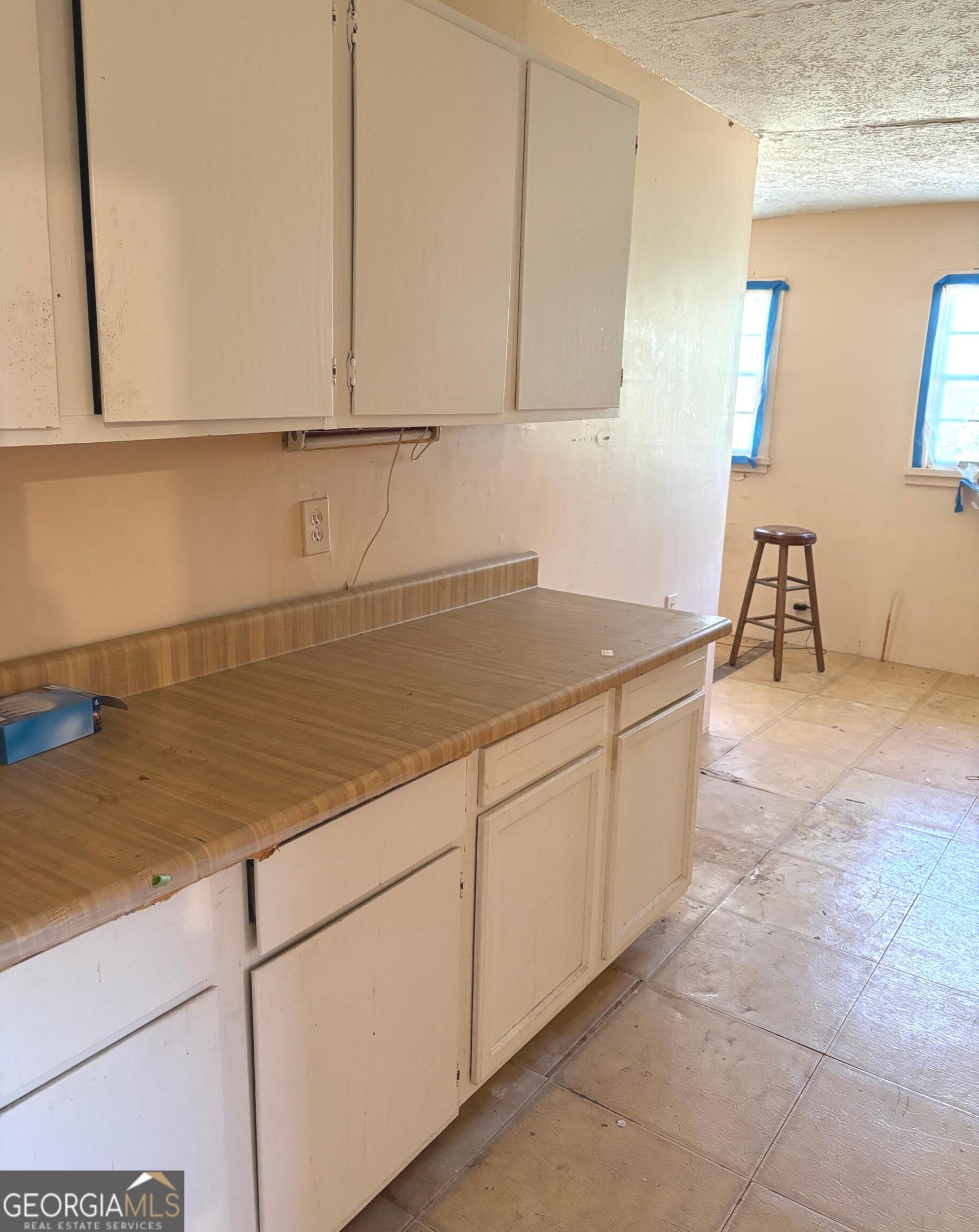 290 Florida Avenue Southwest Atlanta, GA 30310 - Photo 10 of 12 a kitchen with stainless steel appliances granite countertop a sink and cabinets