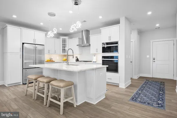 a kitchen with a sink cabinets and stainless steel appliances