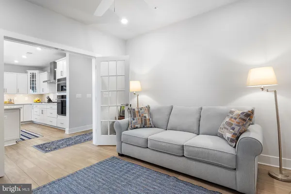 a living room with furniture fireplace and flat screen tv