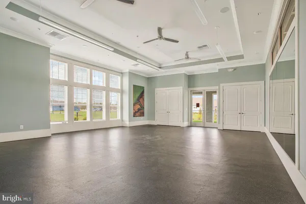 a view of swimming pool with seating area and hardwood floor