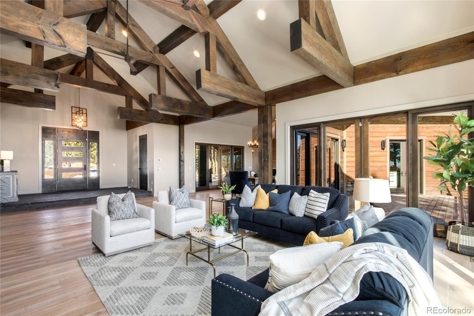 6135 Northway Drive Morrison, CO 80465 - Photo 13 of 40 a living room with furniture and large windows