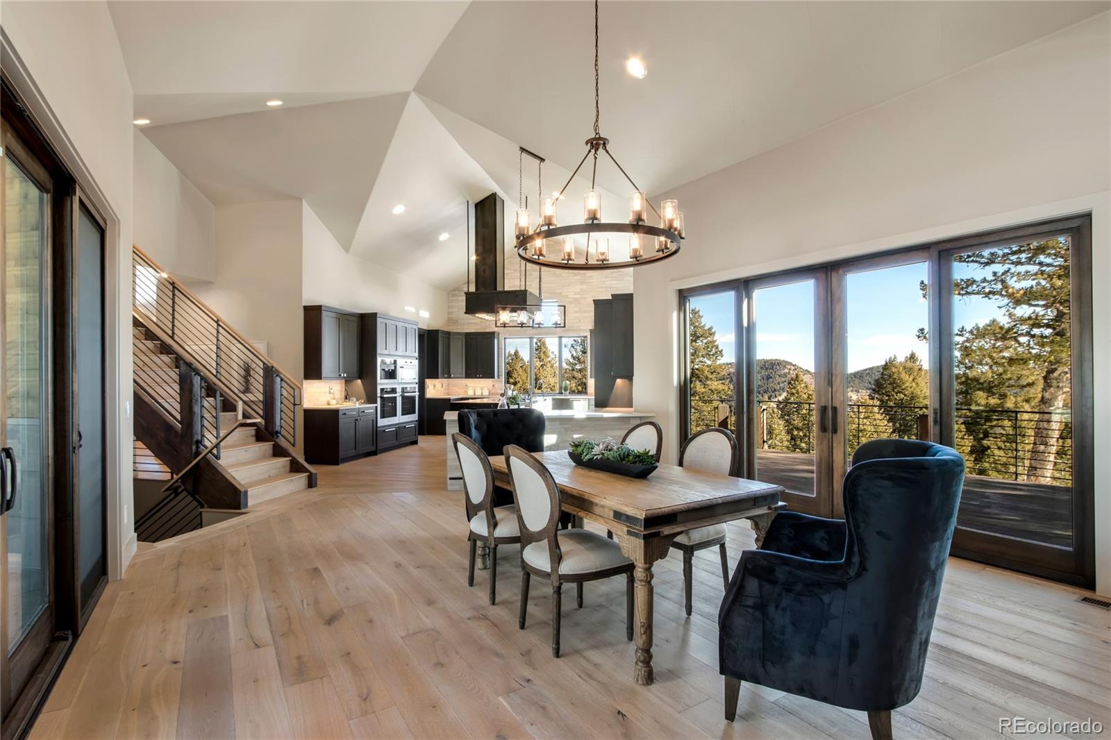 6135 Northway Drive Morrison, CO 80465 - Photo 14 of 40 a view of a dining room with furniture window and wooden floor