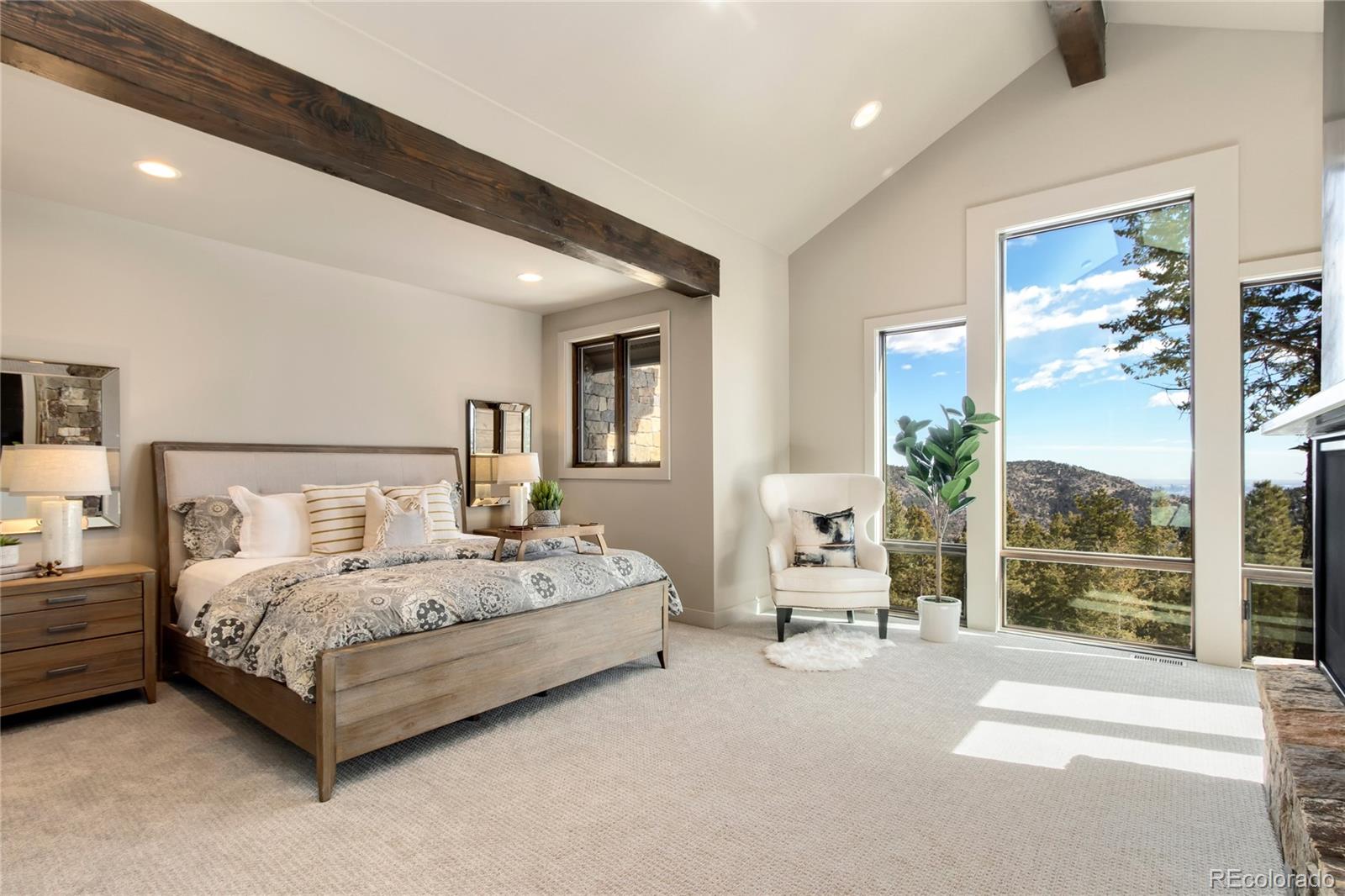 6135 Northway Drive Morrison, CO 80465 - Photo 23 of 40 a living room with a bed and large mirror