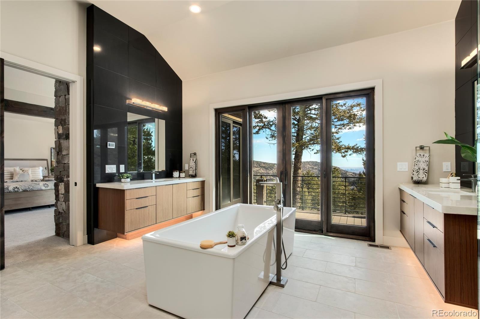 6135 Northway Drive Morrison, CO 80465 - Photo 27 of 40 a large living room with a large window