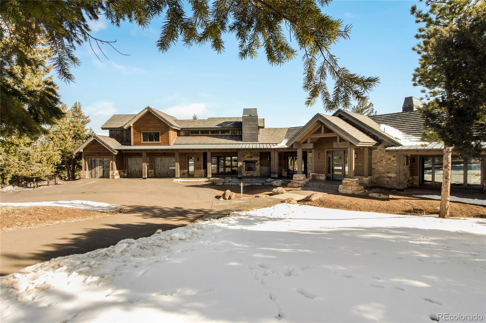 6135 Northway Drive Morrison, CO 80465 - Photo 3 of 40 a front view of a house with a yard
