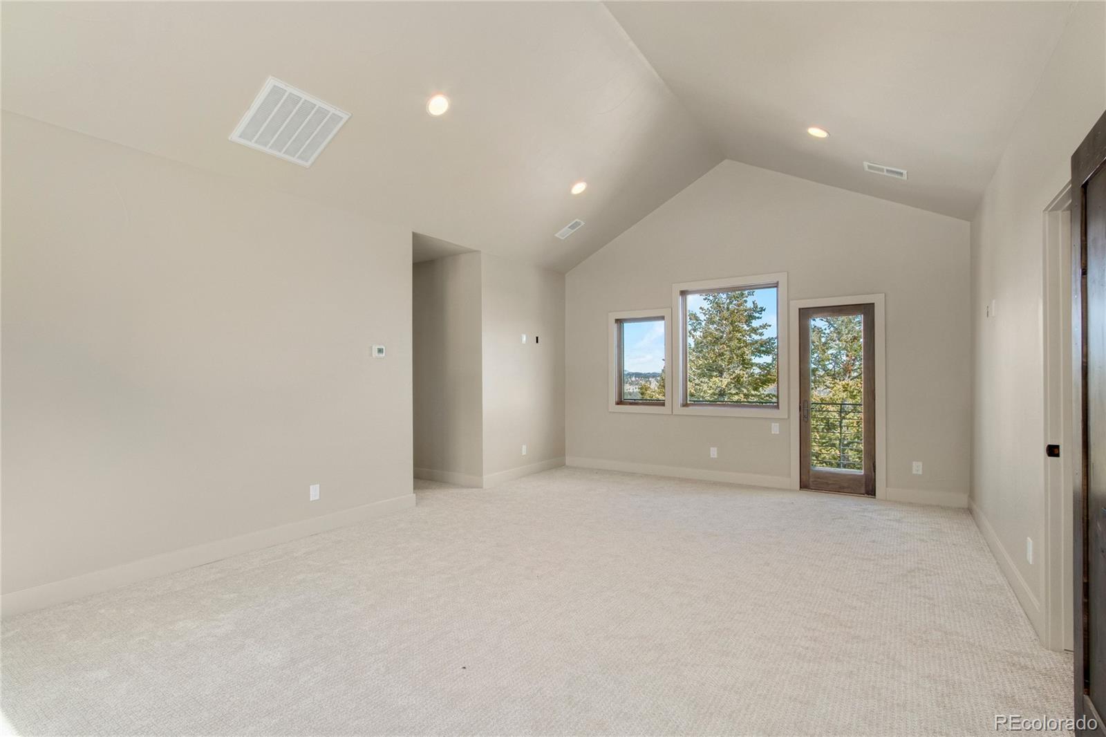 6135 Northway Drive Morrison, CO 80465 - Photo 31 of 40 an empty room with windows and mirror