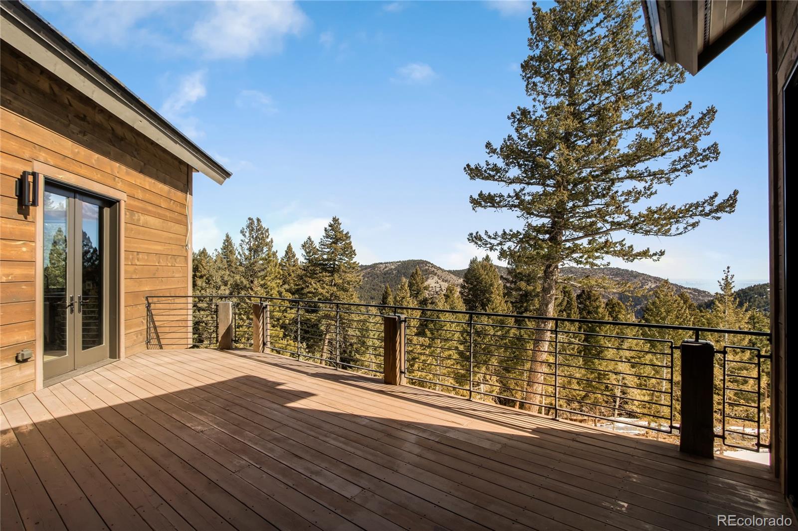 6135 Northway Drive Morrison, CO 80465 - Photo 33 of 40 a view of a house with a ocean view