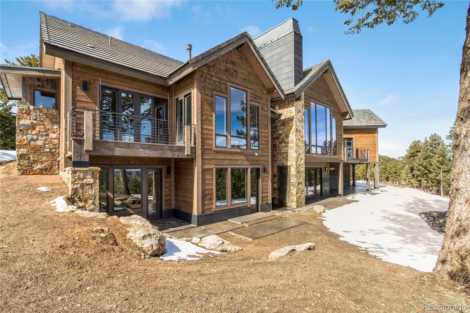 6135 Northway Drive Morrison, CO 80465 - Photo 36 of 40 a front view of a house with a yard