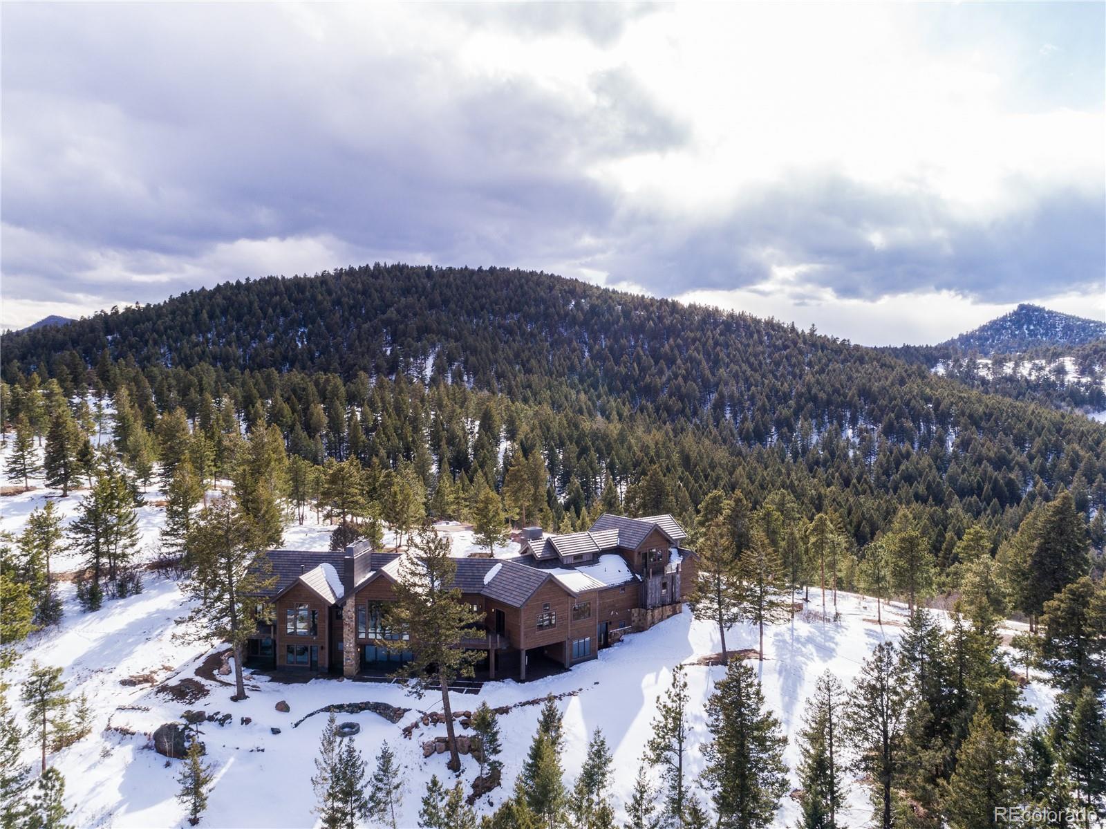 6135 Northway Drive Morrison, CO 80465 - Photo 5 of 40 a view of a lake with a mountain in the background