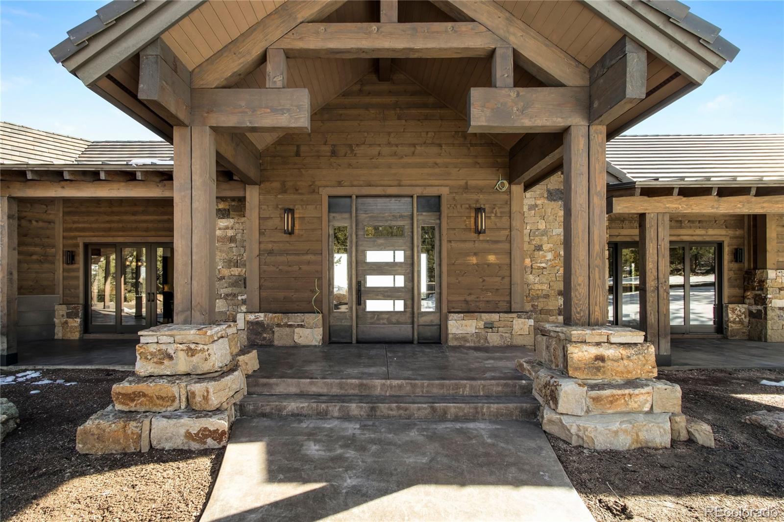 6135 Northway Drive Morrison, CO 80465 - Photo 8 of 40 a front view of a house with outdoor seating