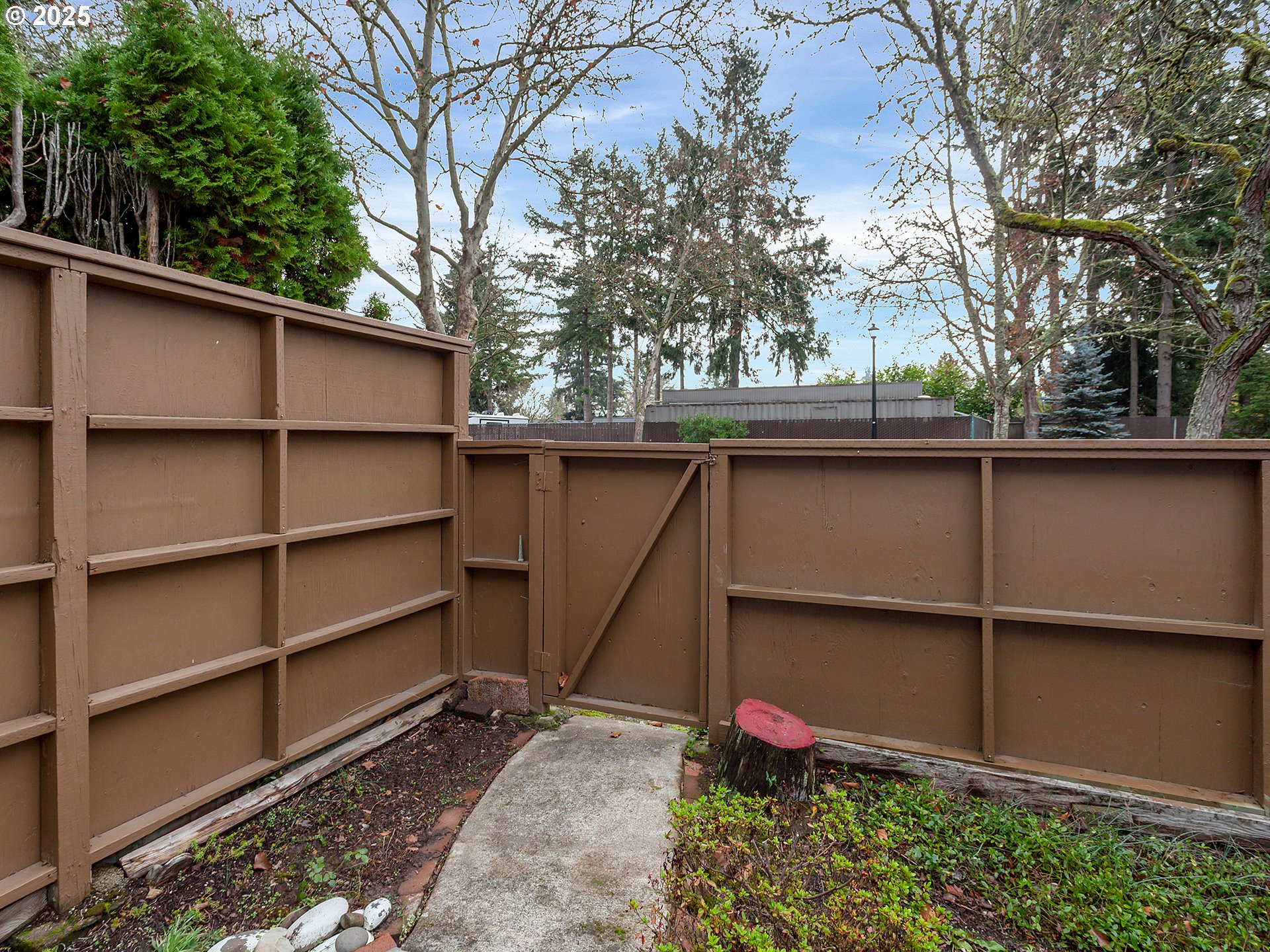 17822 Northwest Lakeway Court Beaverton, OR 97006 - Photo 37 of 45 a small garden covered with tall trees