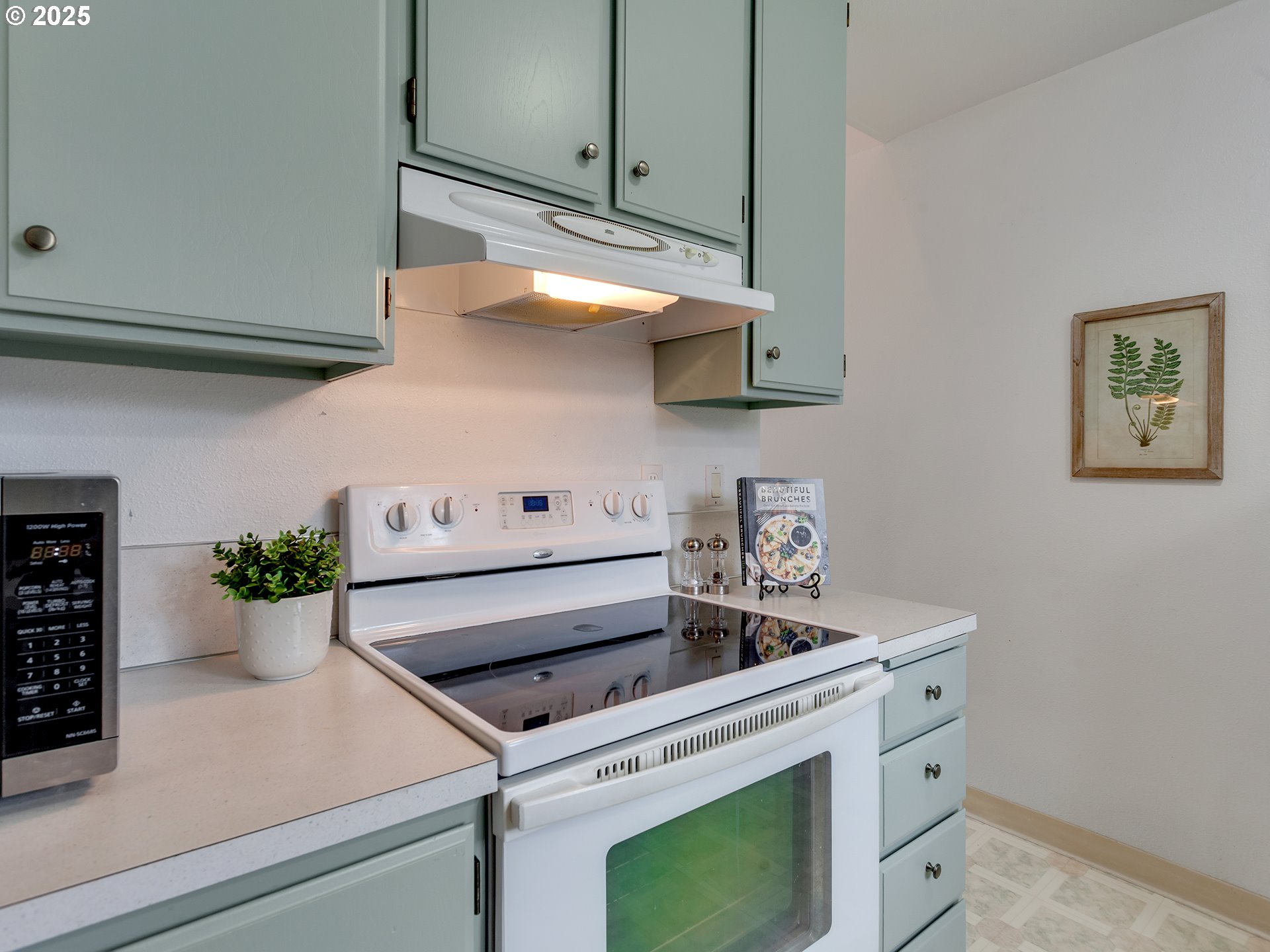 17822 Northwest Lakeway Court Beaverton, OR 97006 - Photo 4 of 45 a white stove top oven sitting inside of a kitchen