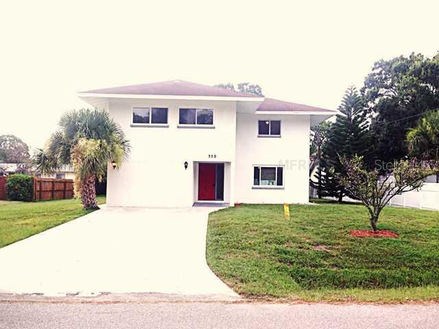 330 Burke Road Venice, FL 34293 - Photo 1 of 1 a front view of a house with a yard
