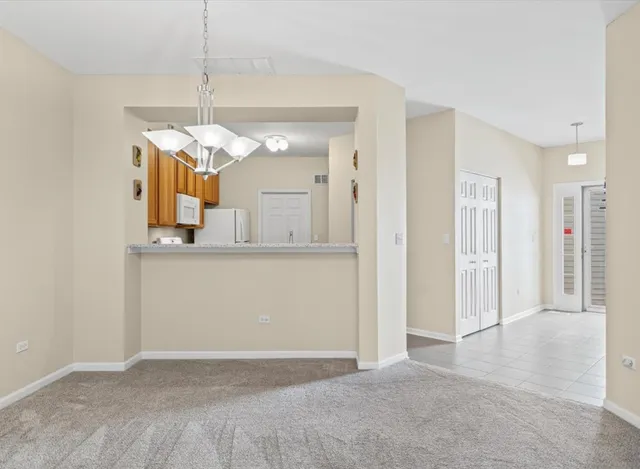 a view of a kitchen and a window