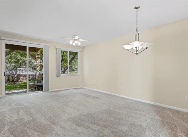 an empty room with windows and outdoor view