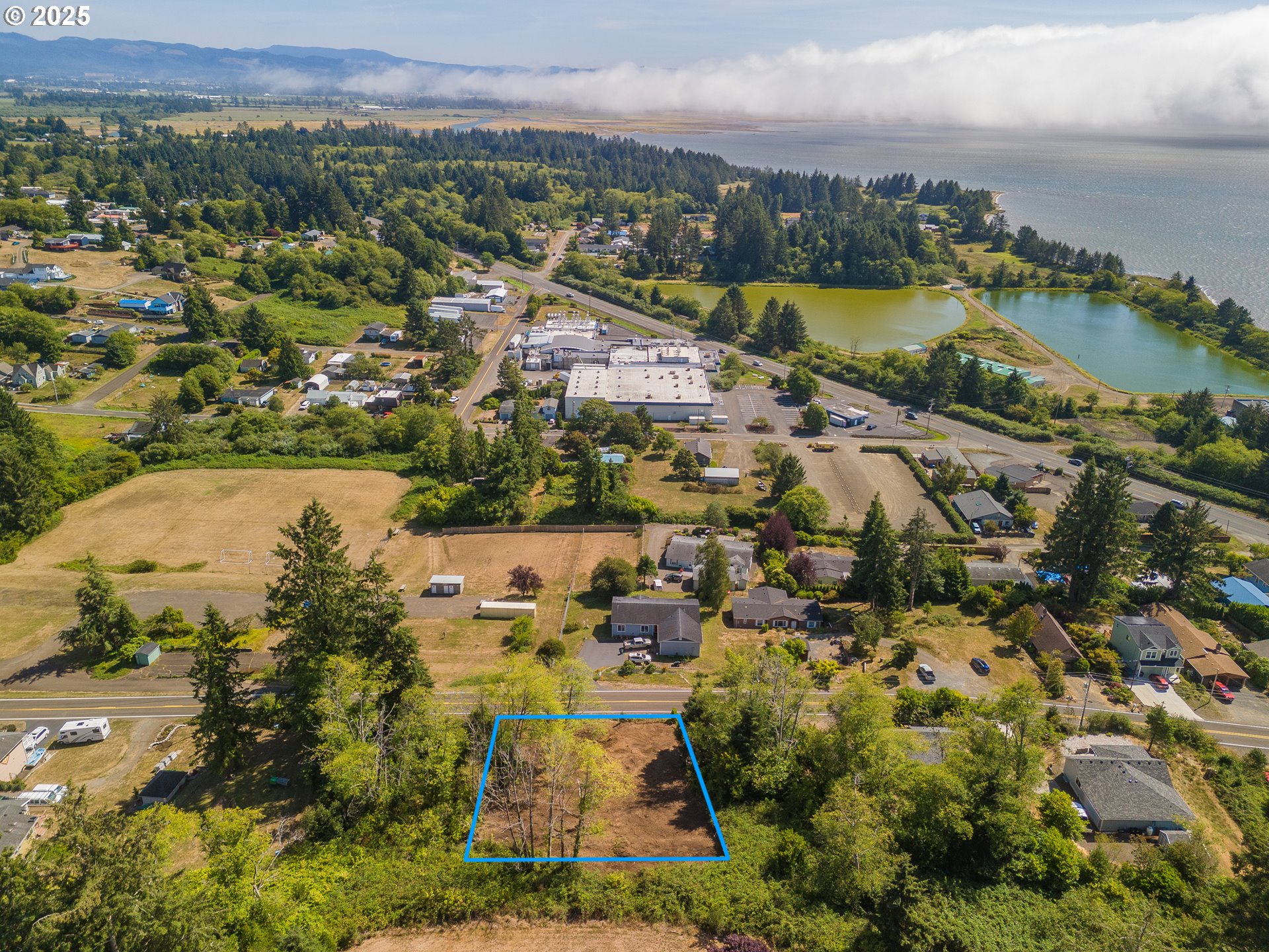 6230 Tillamook Avenue, Unit TL 5400 Bay City, OR 97107 - Photo 5 of 9 an aerial view of residential houses with outdoor space