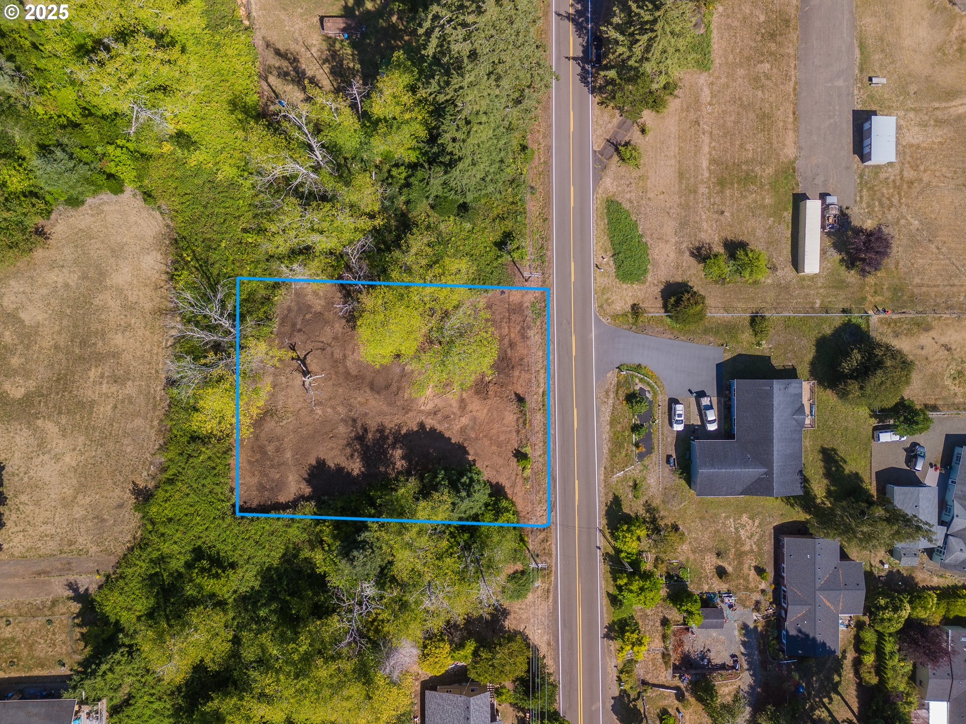 6230 Tillamook Avenue, Unit TL 5400 Bay City, OR 97107 - Photo 6 of 9 an aerial view of a house with a yard