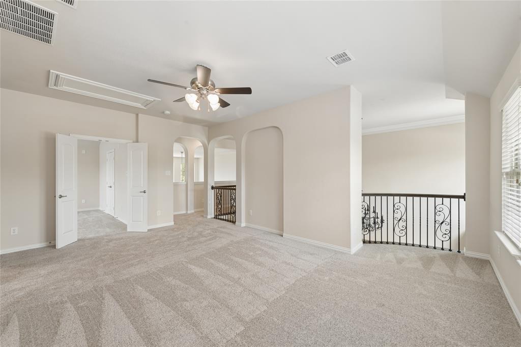 12571 Valley Spring Drive Frisco, TX 75035 - Photo 26 of 39 a view of a livingroom with a ceiling fan and window