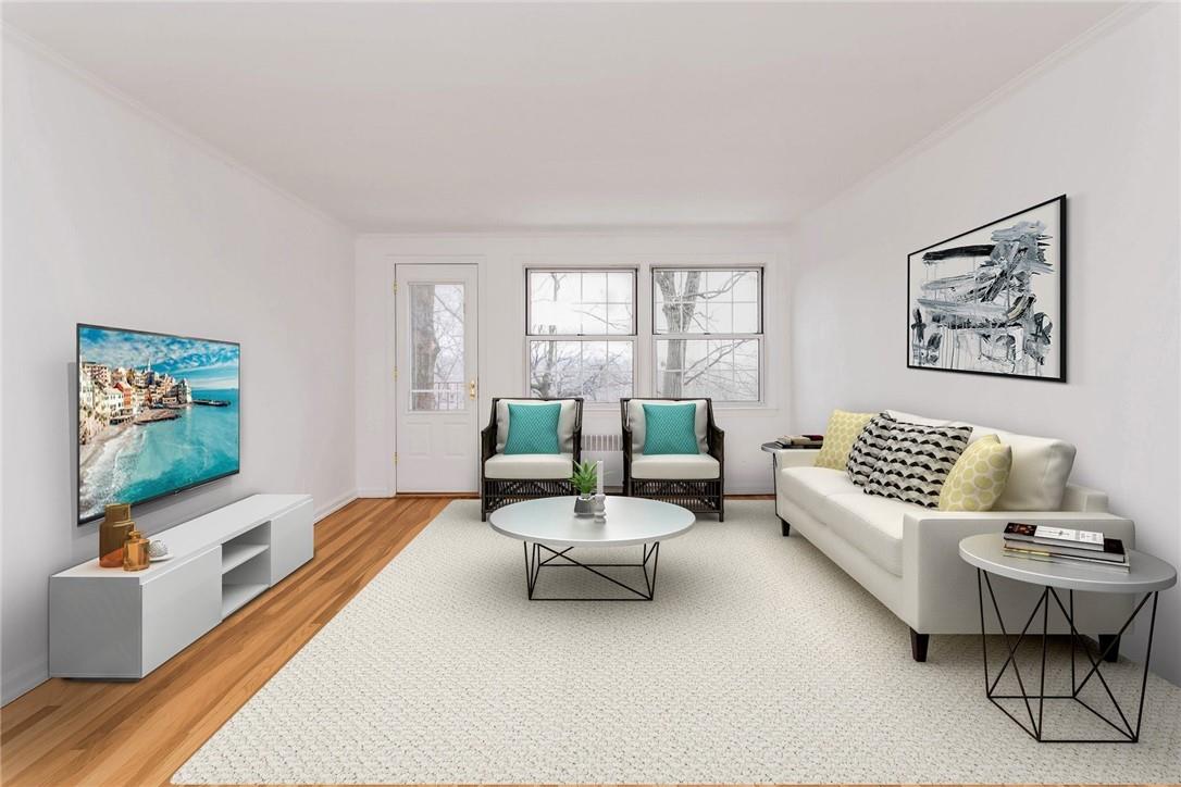 65 Rockledge Road, Unit 1G Bronxville, NY 10708 - Photo 1 of 1 a living room with furniture and a flat screen tv