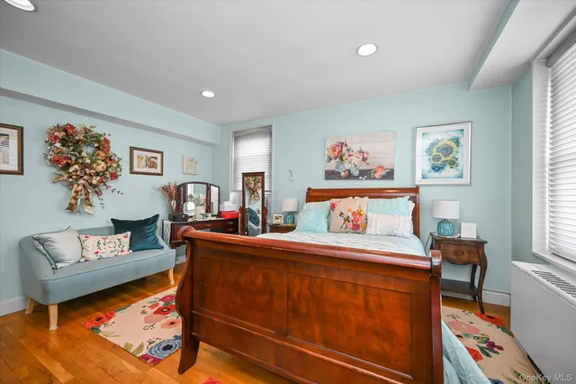 a bedroom with furniture and a book shelf
