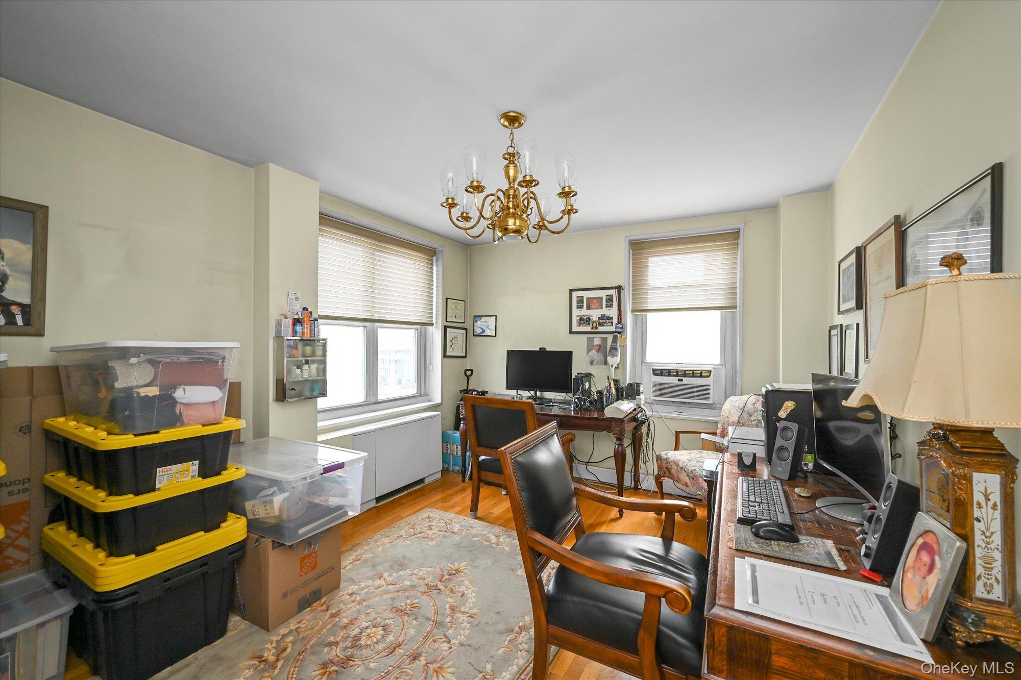 211-40 18th Avenue, Unit 4A Queens, NY 11360 - Photo 13 of 21 a living room with furniture fireplace and a window
