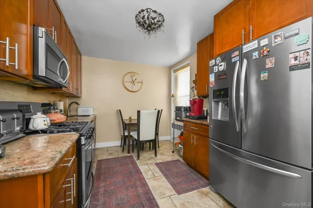 a dining room with furniture a chandelier and wooden floor