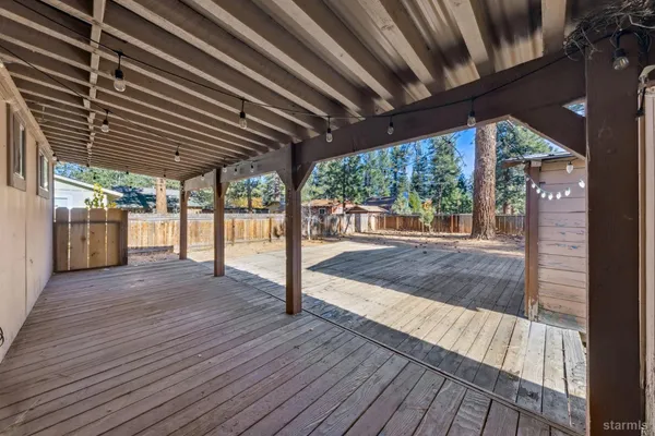 a view of porch with wooden floor