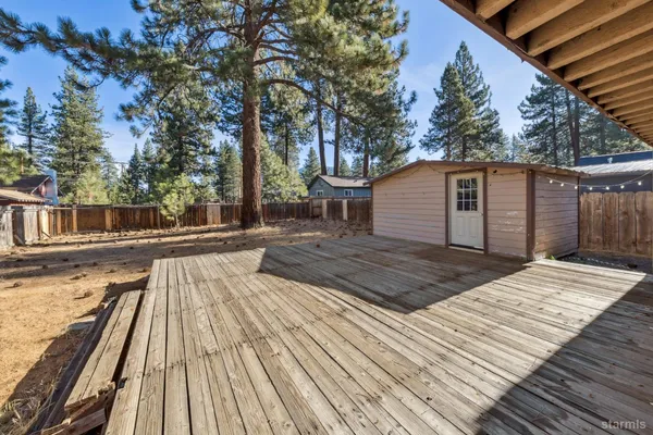 a view of a backyard of the house