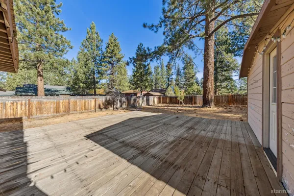 a view of a backyard with wooden floor