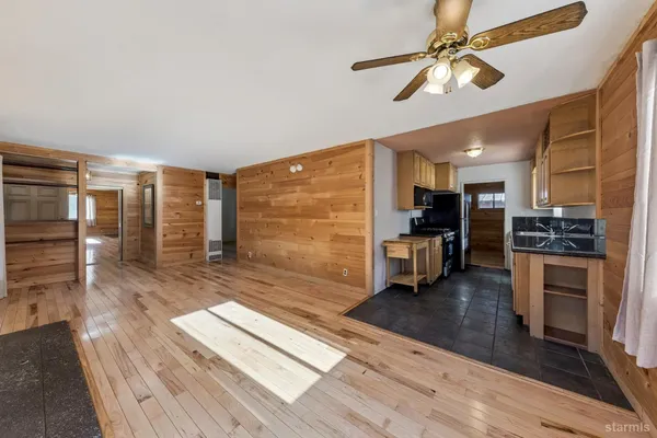 a view of kitchen with furniture and wooden floor