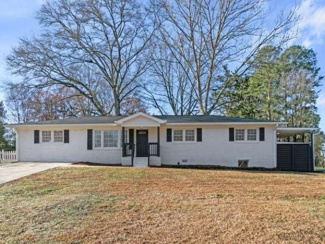 4013 Oglesby Road Powder Springs, GA 30127 - Photo 1 of 1 front view of house with a yard